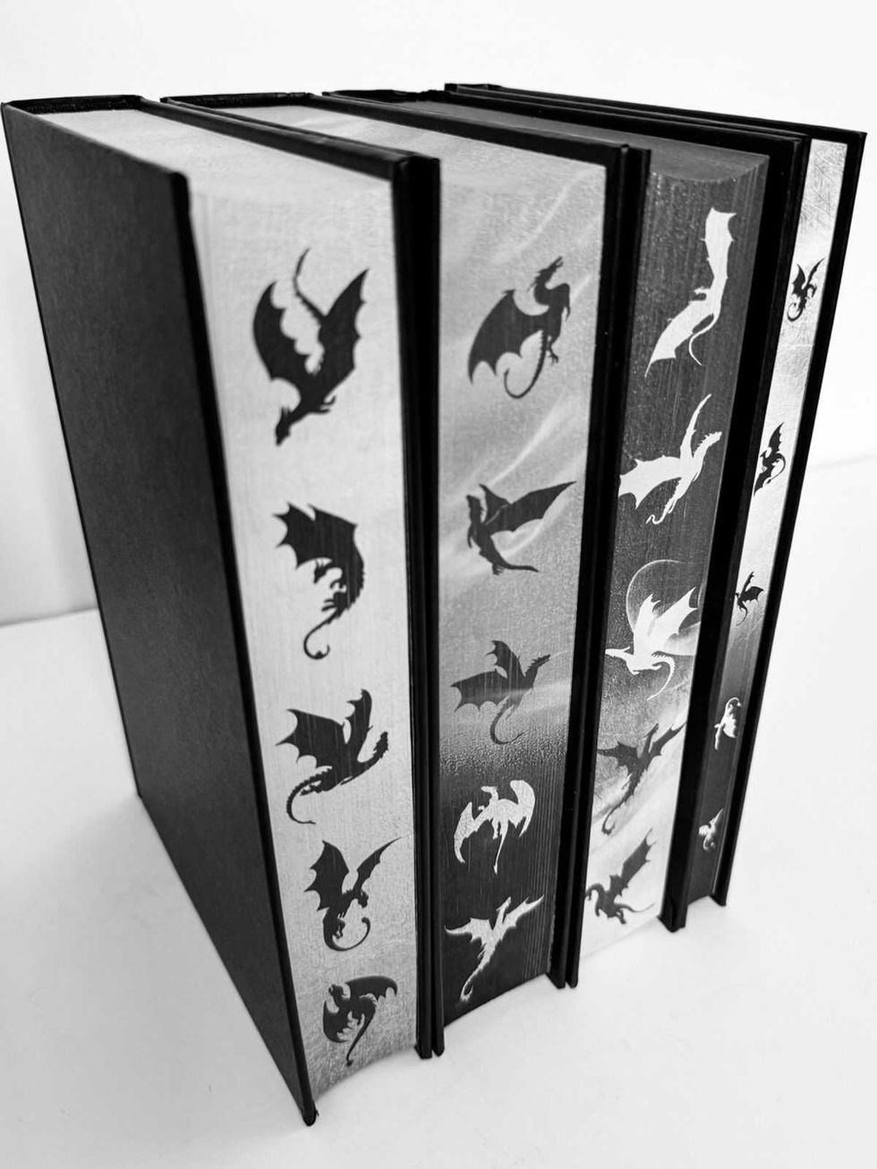 fourth wing book 4 standing beside the other books