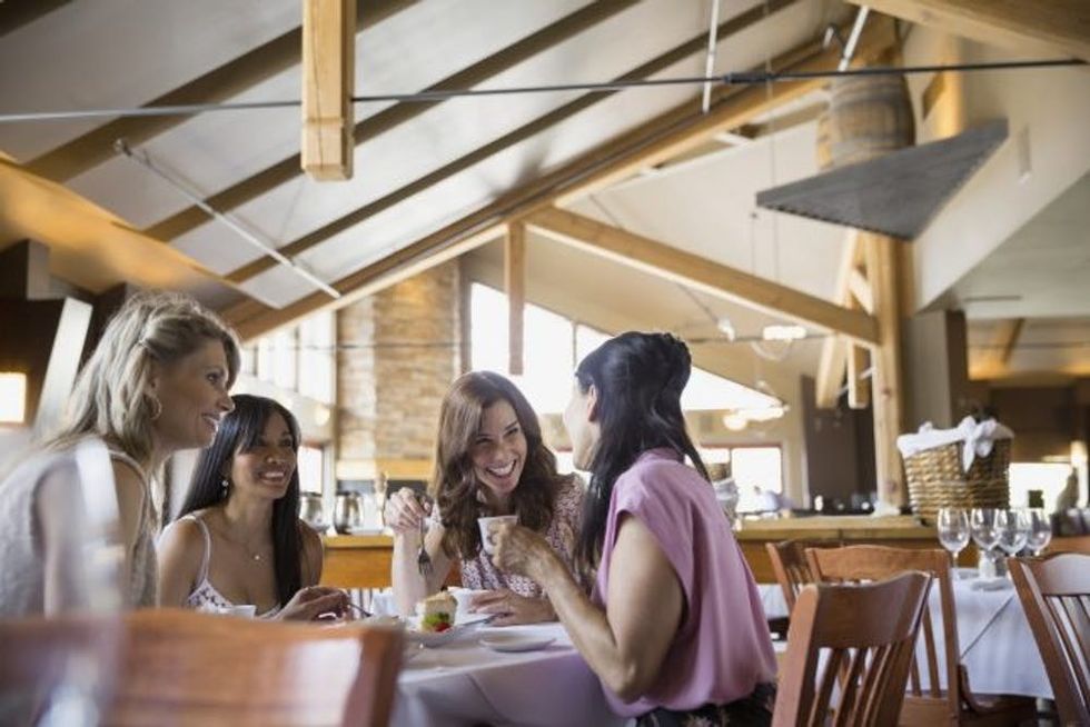 friends-chatting-at-restaurant-square
