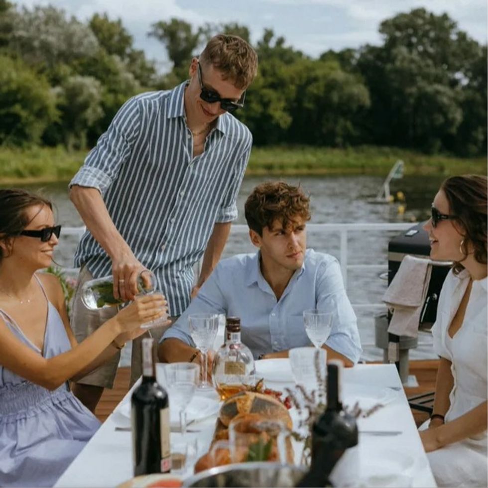 friends eating lunch outside and talking together