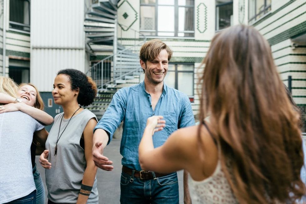 Friends meet and hug