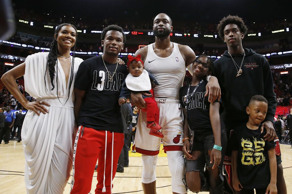 Gabrielle Union-Wade and Dwayne-Wade pictured with children at his final Miami Heat's game