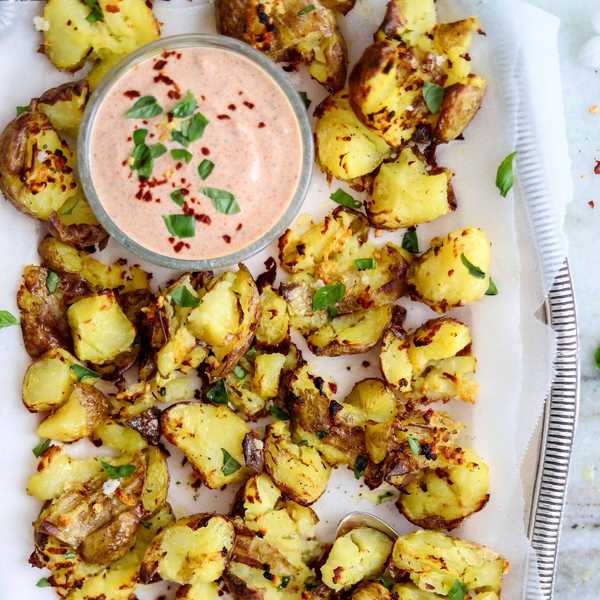 Garlicky Smashed Potatoes with Harissa Yogurt