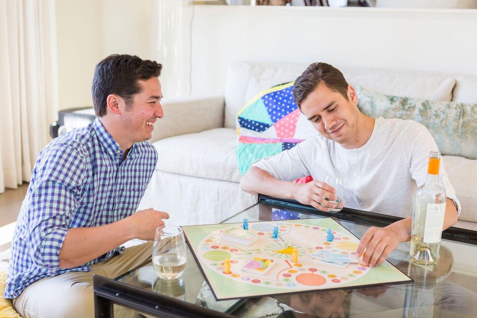 gay couple playing board game