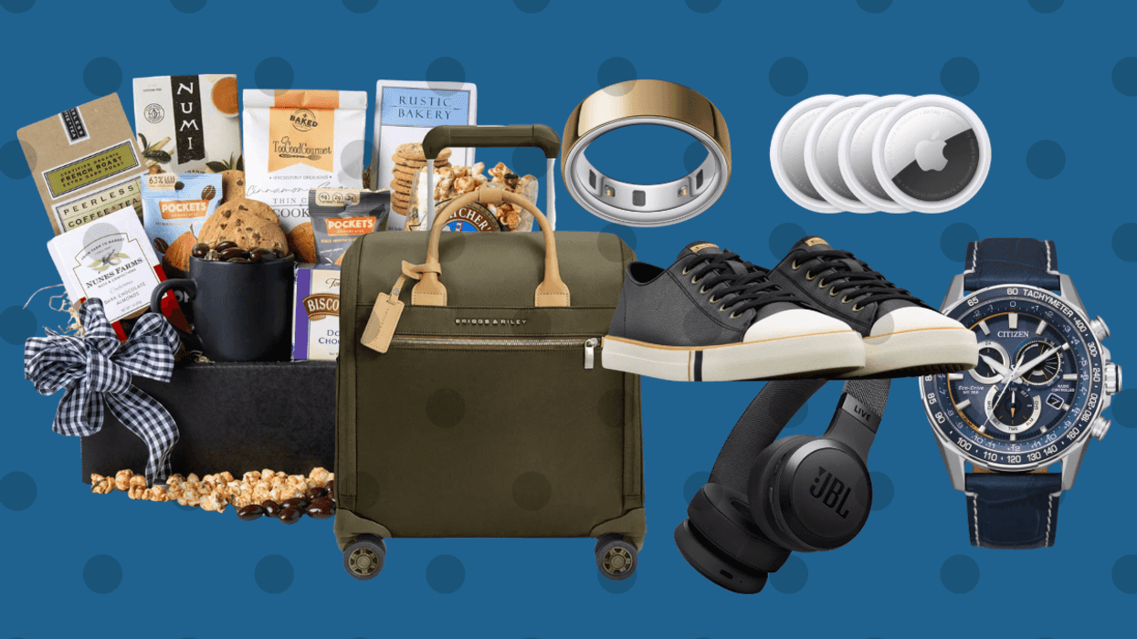 Gift set with snacks, luggage, sneakers, smartwatch, headphones on a blue polka dot background.