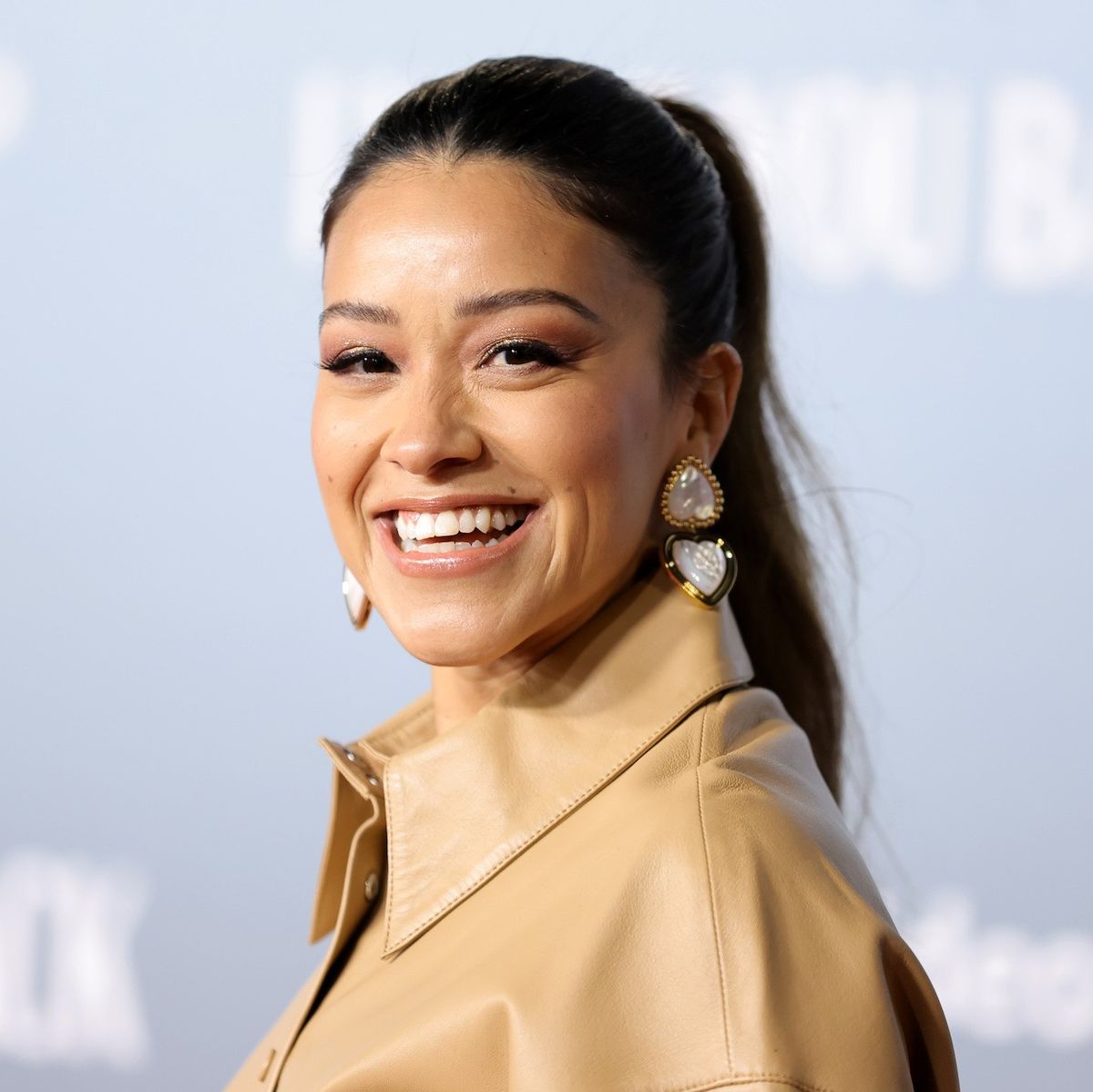 gina rodriguez against a pale blue background spy kids 5