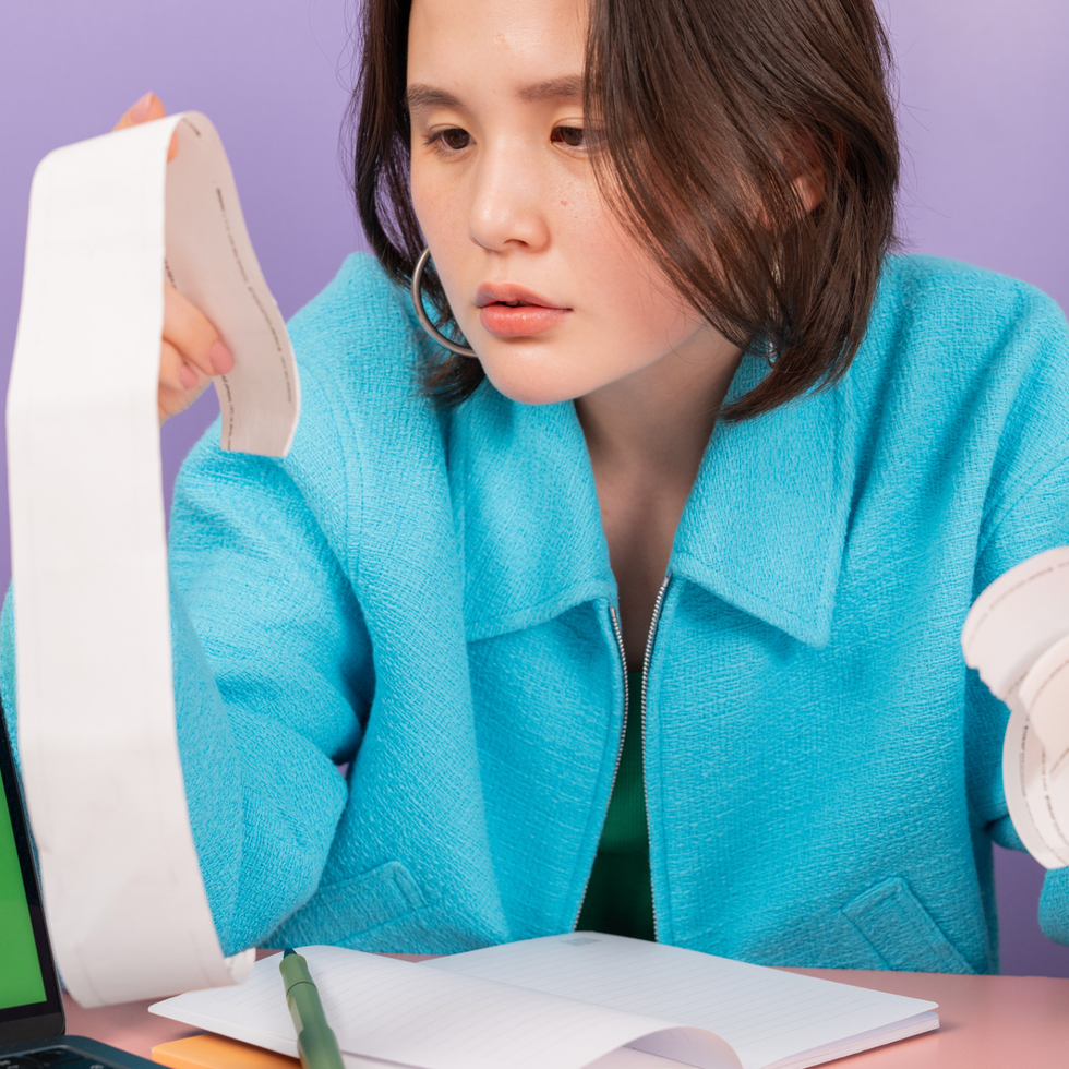 girl dealing with finances mercury retrograde