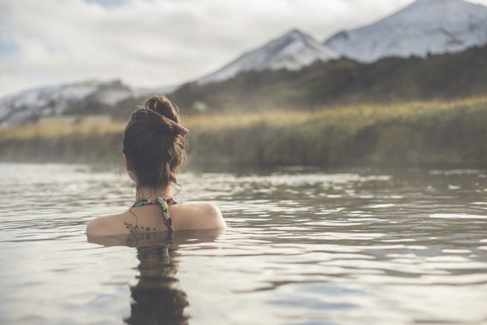Girl-in-a-hot-spring-in-Iceland-Landmannalaugar-000056868416_Large