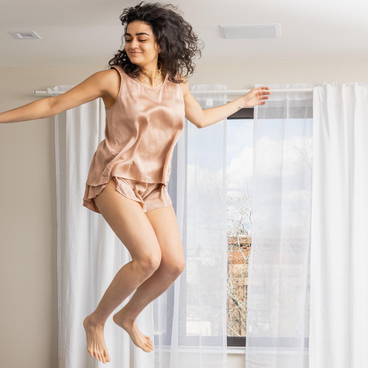girl jumping on the bed how to fight seasonal depression