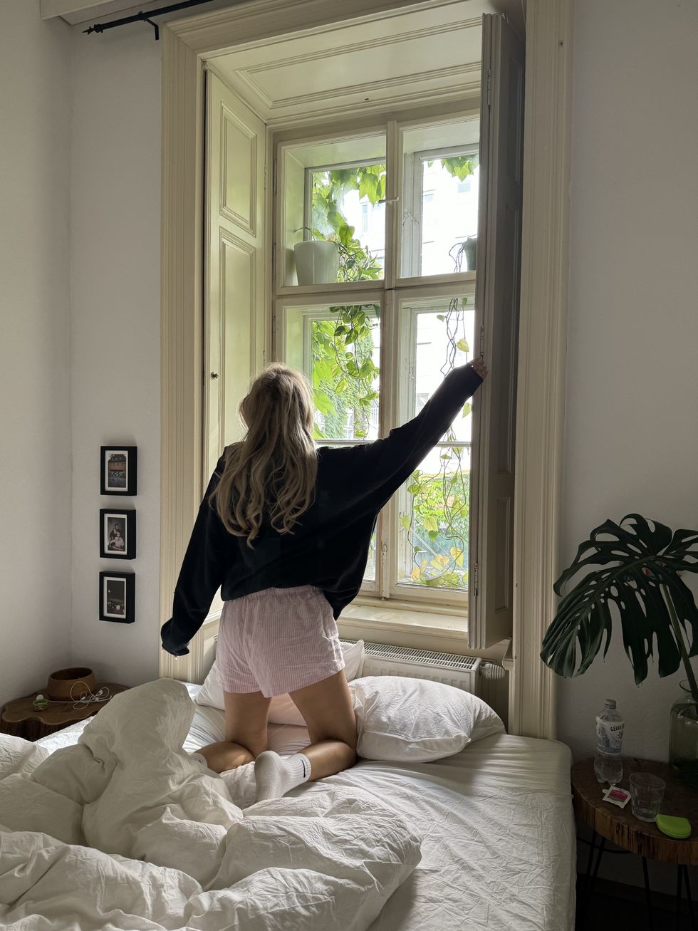 girl opening her window