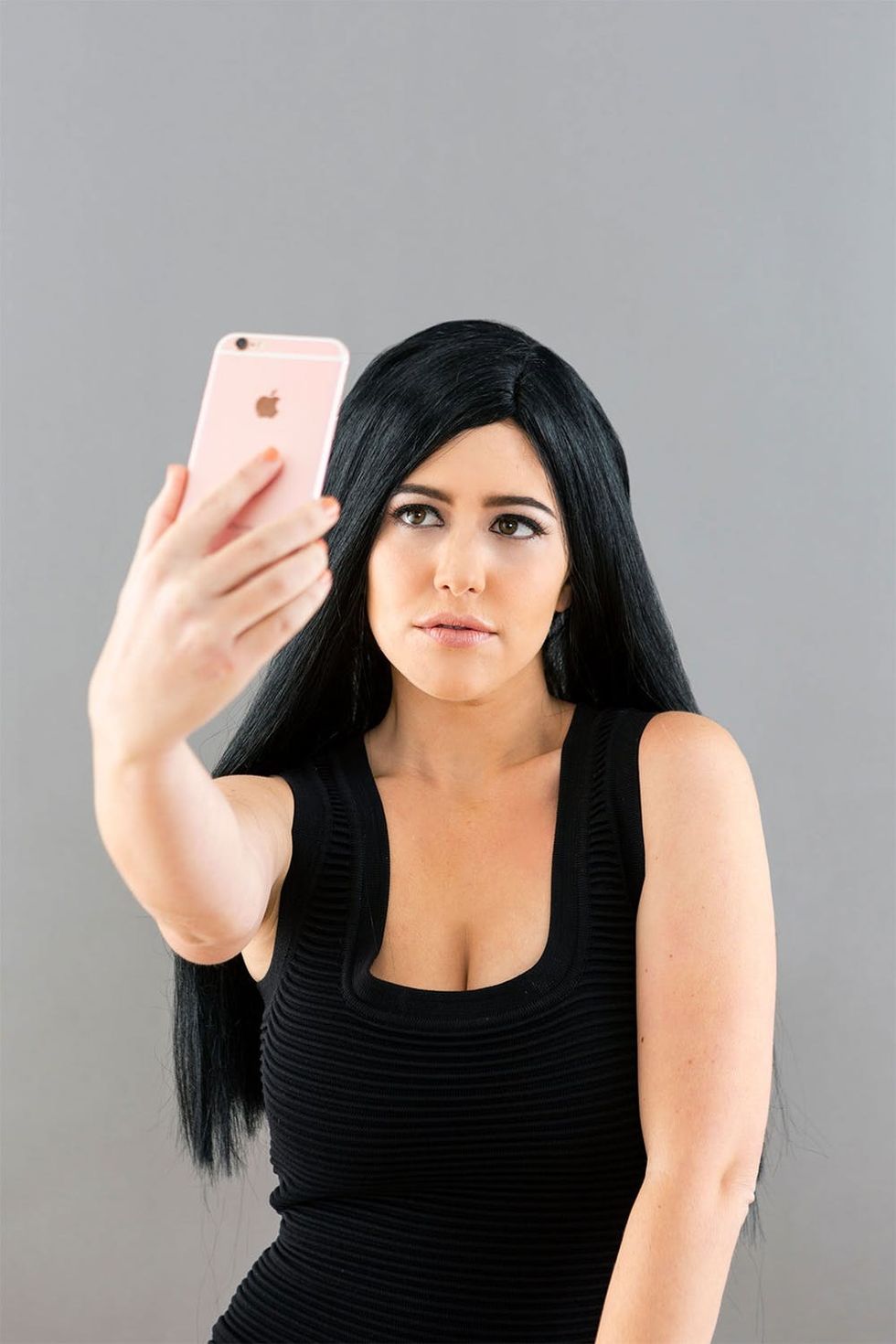 Girl taking a selfie of bold brows.