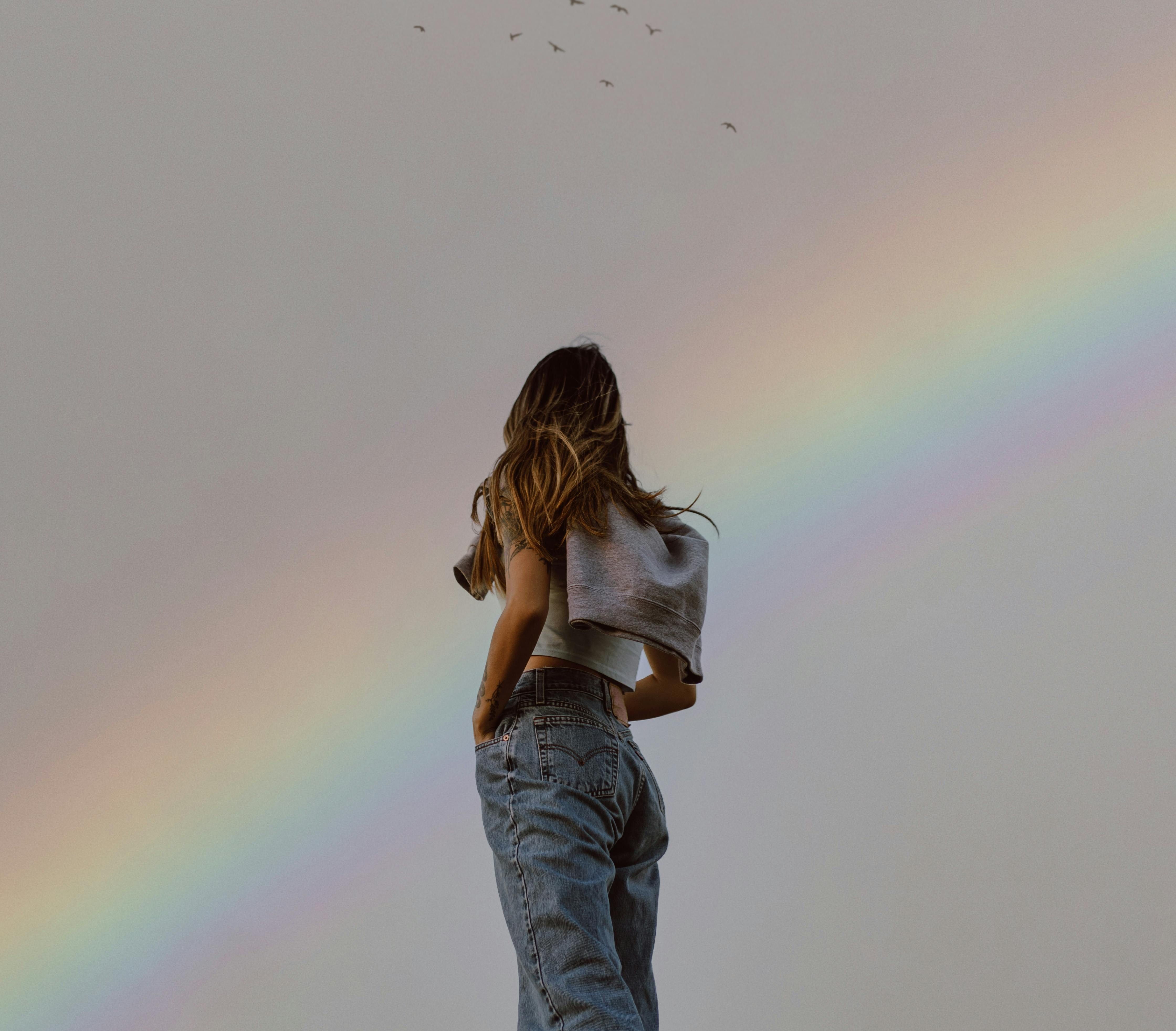 girl with rainbow behind her weekly horoscopes