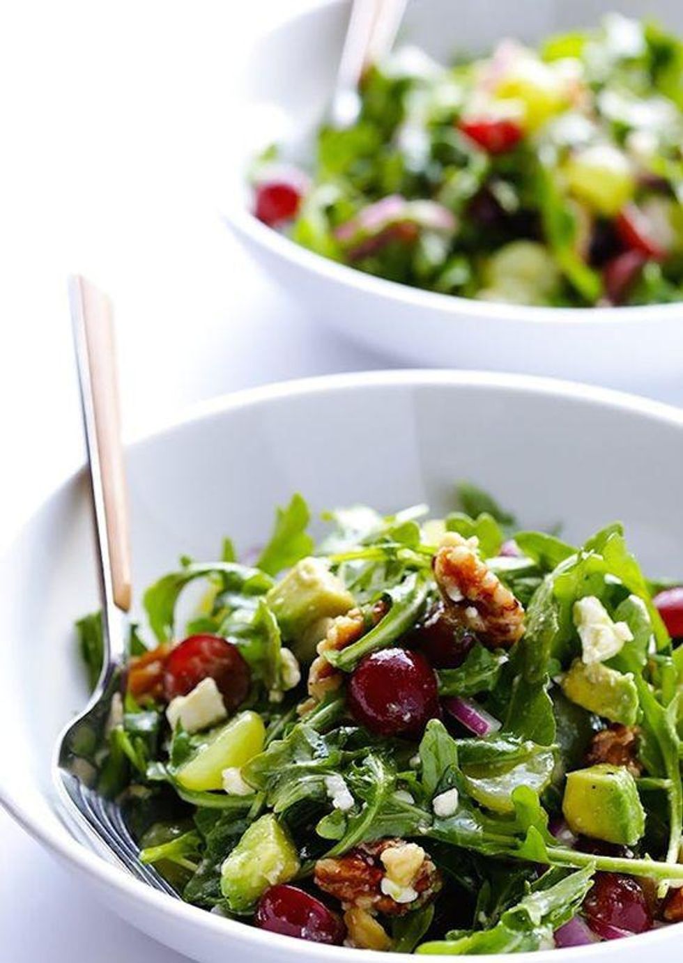 Grape, Avocado and Arugula Salad in a white bowl