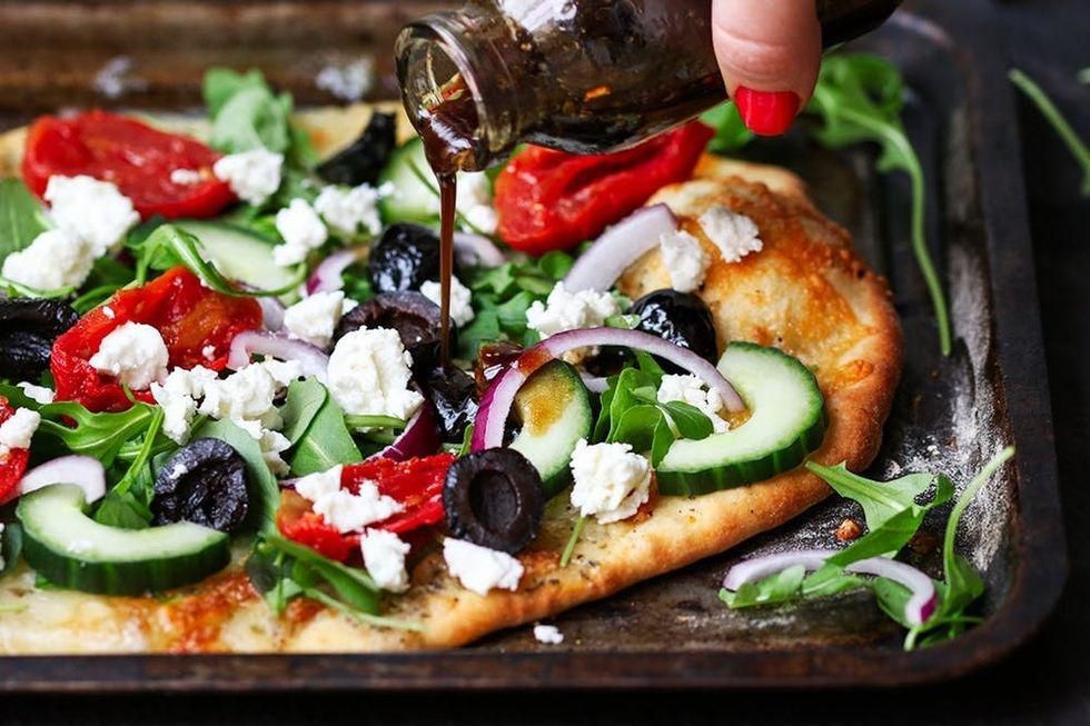 greek salad pizza with olives, feta, onions and peppers