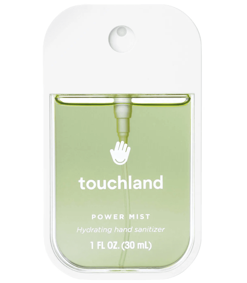 Green Touchland Power Mist hydrating hand sanitizer in a sleek portable bottle.