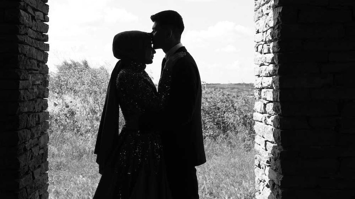 groom kissing bride on the forehead do men marry for love