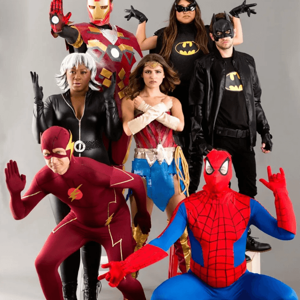 Group of people in superhero costumes posing together.