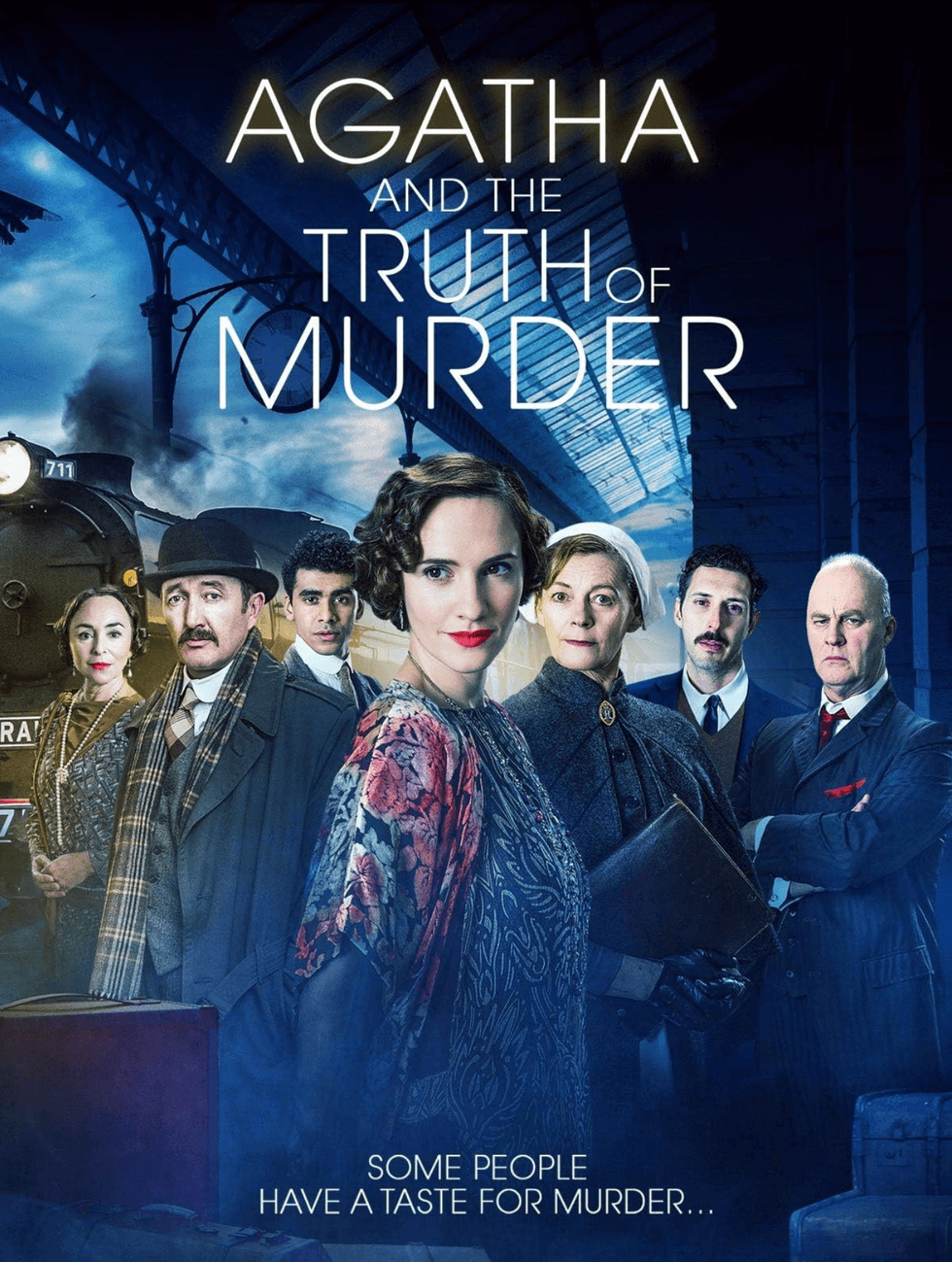 Group of people in vintage attire on a train platform, "Agatha and the Truth of Murder."