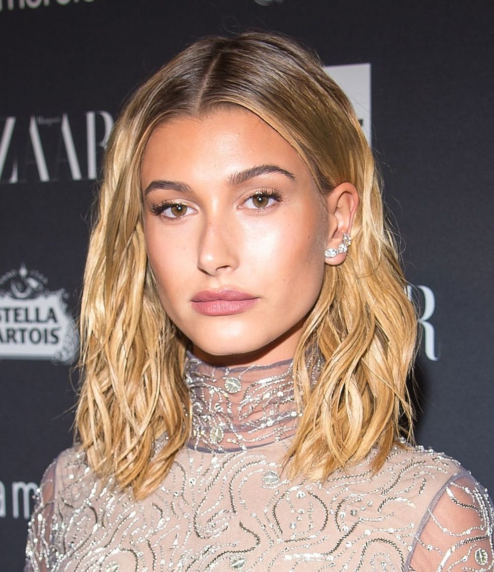 Hailey Bieber rocking mid-length blonde strands.