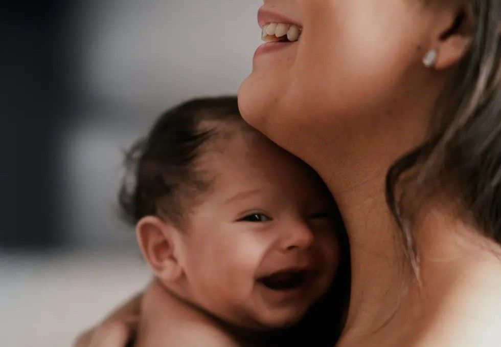 happy baby being held