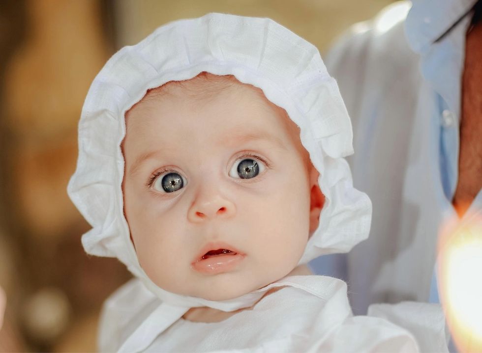 happy baby in a bonnet