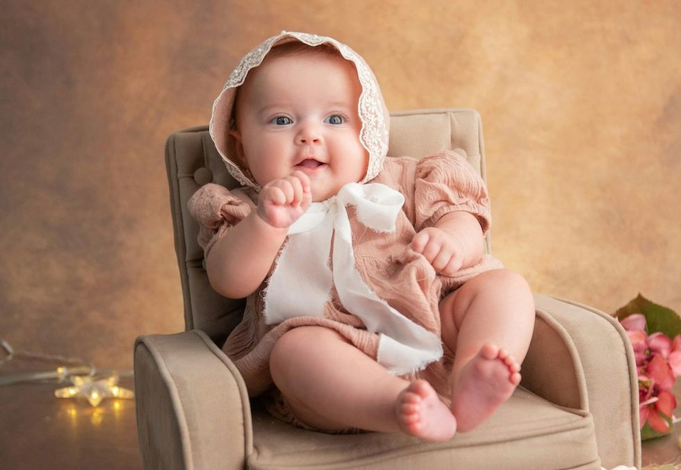 happy baby in a bonnet