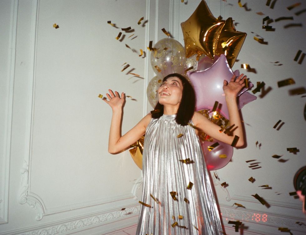 happy girl with confetti lucky girl syndrome