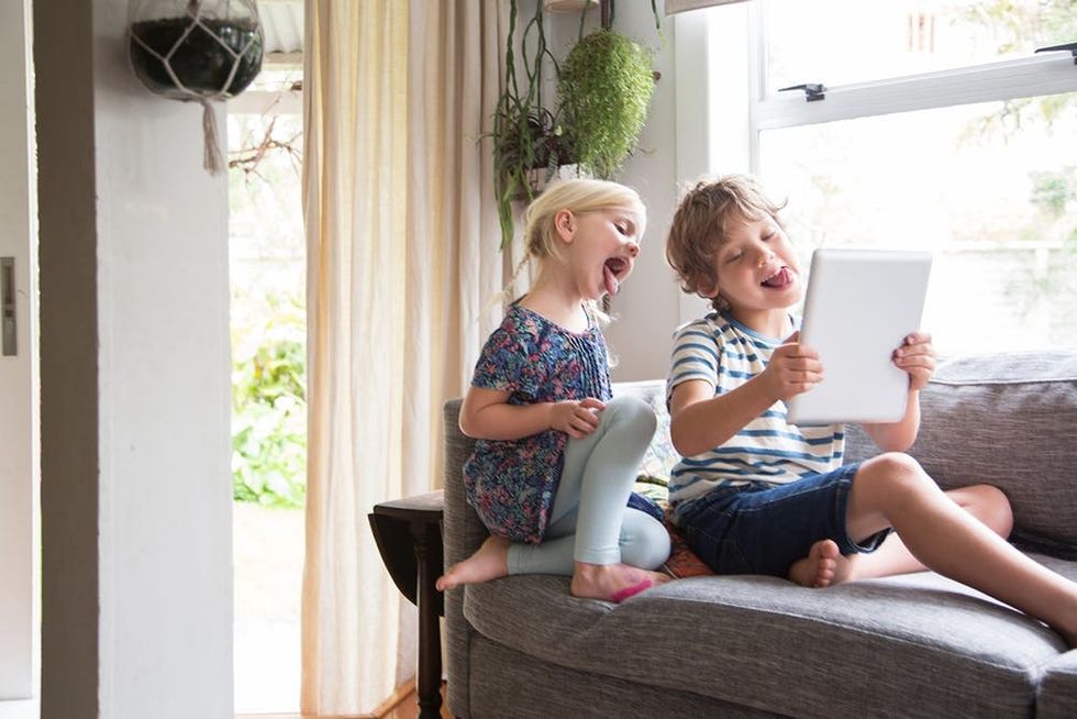 Happy kids looking at tablet
