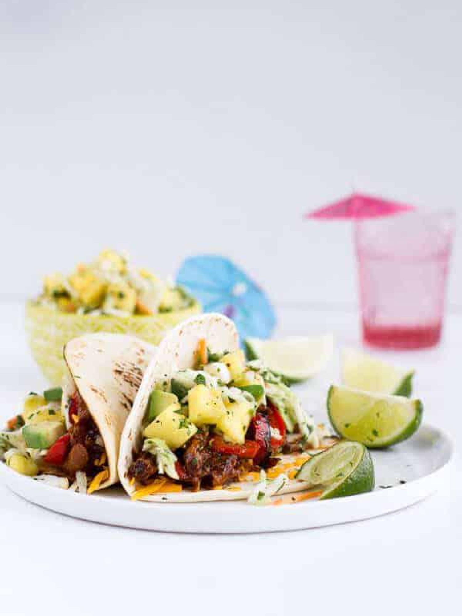 hawaiian pork fajitas with coconut rice, fruit and limes