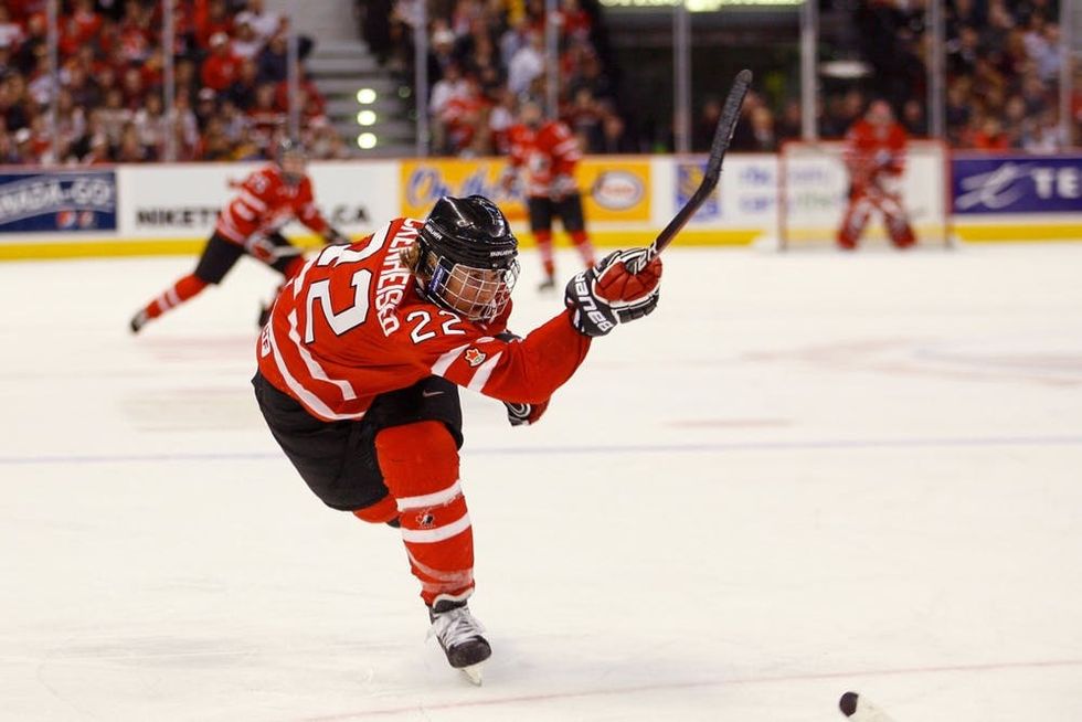 Hayley Wickenheiser of Team Canada shoots the puck during a 2010 game against Team USA