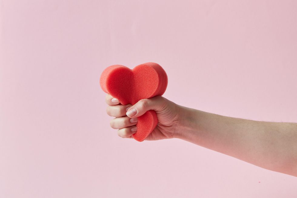 heart shaped sponge being crushed in a hand dreaming about an ex