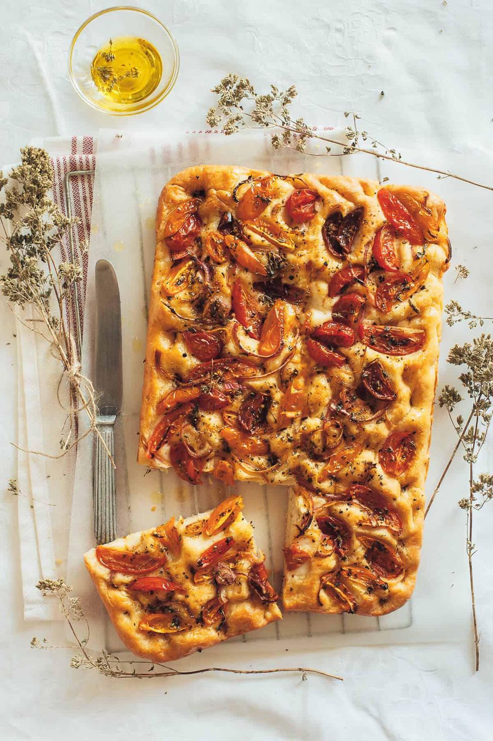 Heirloom Tomato Ladenia with flowers and olive oil