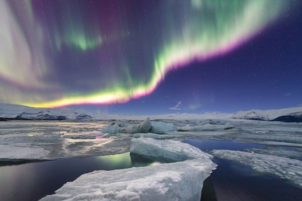 High kp northern light displays over jokulsarlon glacier lagoon, iceland.