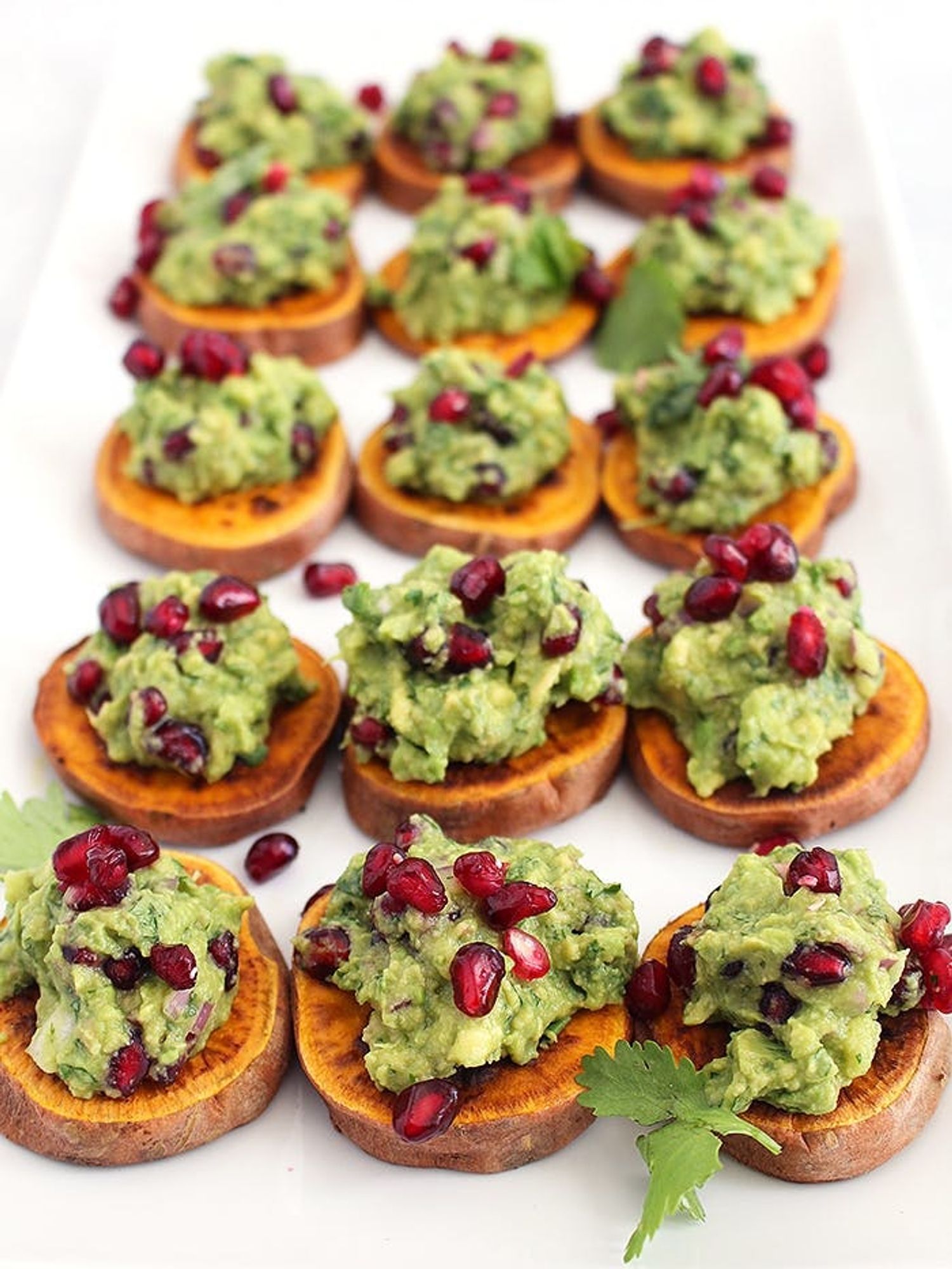 Holiday Pomegranate Guacamole on Roasted Sweet Potato Toasts as christmas appetizers