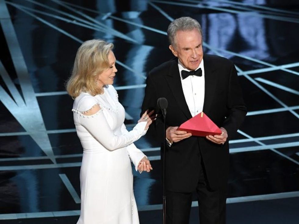 HOLLYWOOD, CA - FEBRUARY 26: Actors Faye Dunaway (L) and Warren Beatty speak onstage during the 89th Annual Academy Awards at Hollywood & Highland Center on February 26, 2017 in Hollywood, California. (Photo by Kevin Winter/Getty Images)