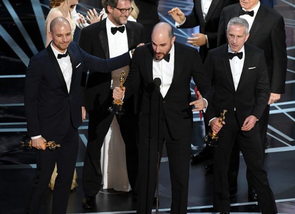 HOLLYWOOD, CA - FEBRUARY 26: (L-R) Prior to learning of a presentation error, 'La La Land' producers Fred Berger, Jordan Horowitz and Marc Platt accept the Best Picture award for 'La La Land' (later awarded to actual Best Picture winner 'Moonlight') onstage during the 89th Annual Academy Awards at Hollywood & Highland Center on February 26, 2017 in Hollywood, California. (Photo by Kevin Winter/Getty Images)