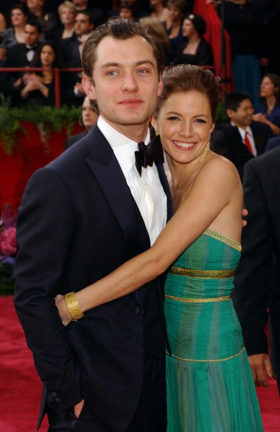 HOLLYWOOD, CA - FEBRUARY 29: Actor Jude Law, nominated for Best Actor in a Leading Role for his performance in "Cold Mountain" and his girlfriend Sienna Miller attend the 76th Annual Academy Awards at the Kodak Theater on February 29, 2004 in Hollywood, California. (Photo by Vince Bucci/Getty Images)