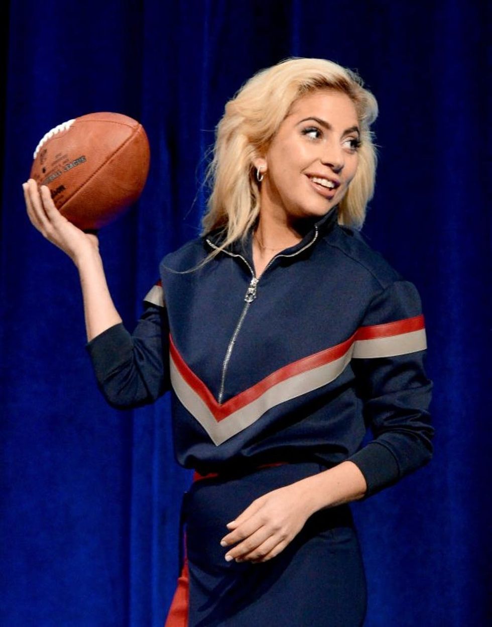 HOUSTON, TX - FEBRUARY 02: Lady Gaga poses with a football onstage at the Pepsi Zero Sugar Super Bowl LI Halftime Show Press Conference on February 2, 2017 in Houston, Texas. (Photo by Kevin Mazur/WireImage)