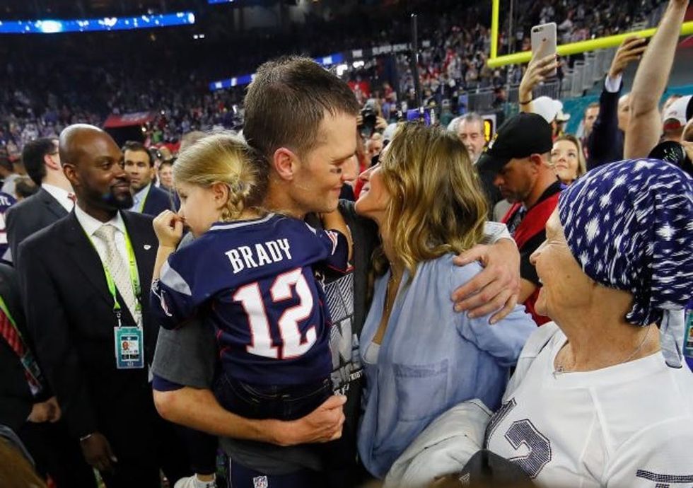 HOUSTON, TX - FEBRUARY 05: Tom Brady #12 of the New England Patriots celebrates with wife Gisele Bundchen and daughter Vivian Brady after defeating the Atlanta Falcons during Super Bowl 51 at NRG Stadium on February 5, 2017 in Houston, Texas. The Patriots defeated the Falcons 34-28. (Photo by Kevin C. Cox/Getty Images)