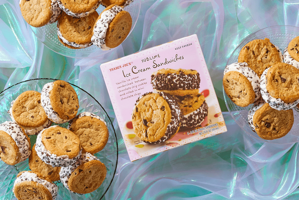 Ice cream sandwiches on plates with the product box, set on a shimmering fabric background.