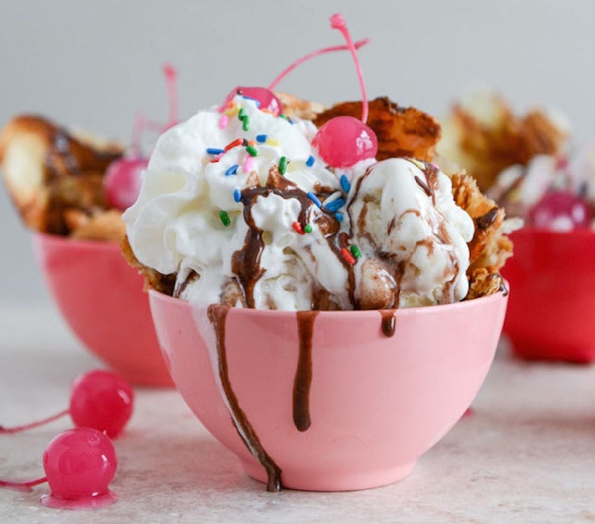 Ice Cream Sundaes in a pink bowl with sprinkles