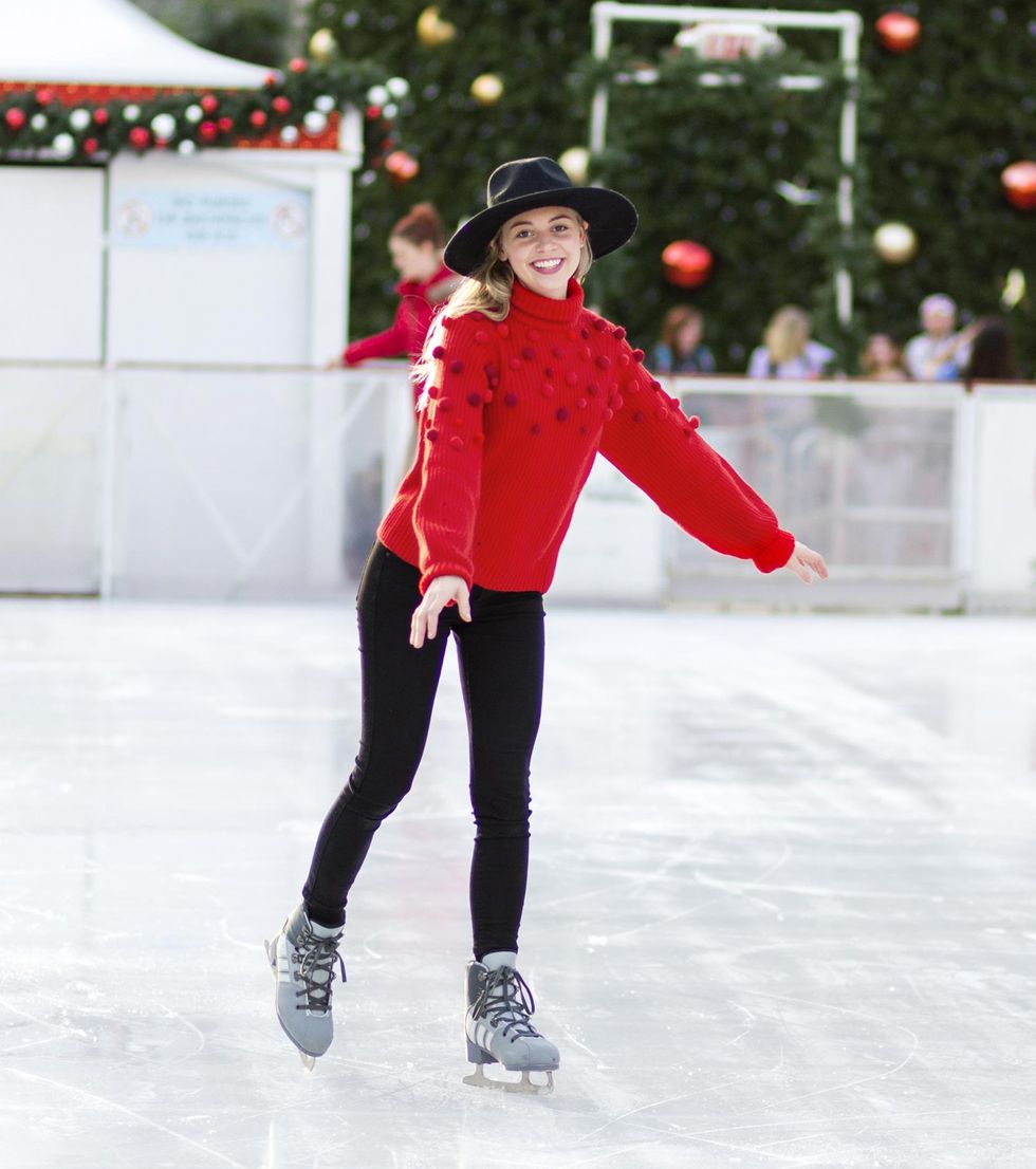 ice skating in a red sweater experience gift