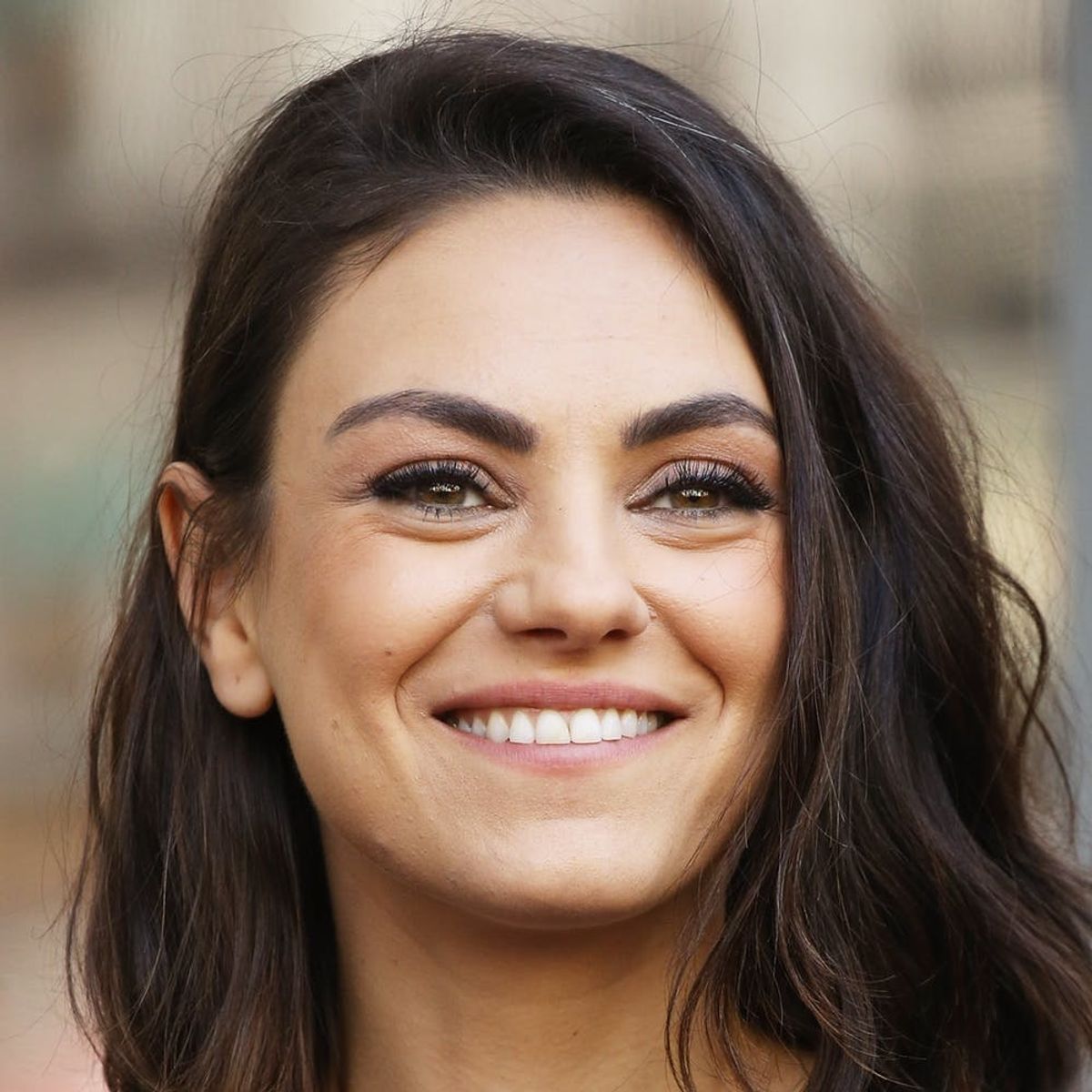 Mila Kunis Debuts Dramatic Dark Fringe on the Billboard Music Awards Red Carpet