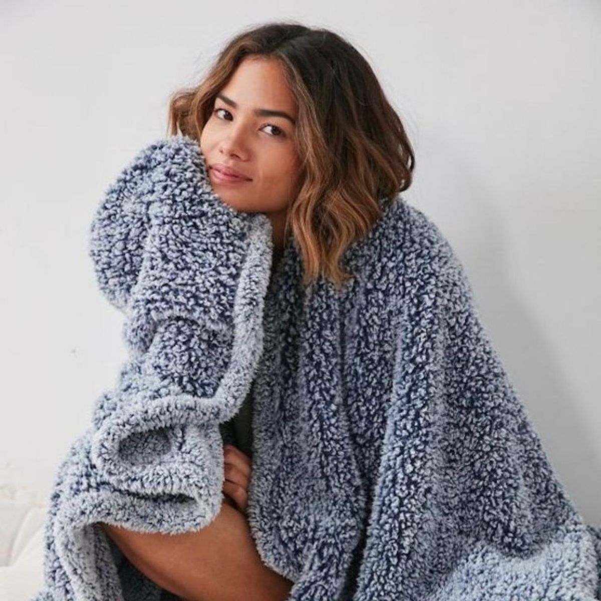 14 Cozy Throw Blankets to Snuggle Up With This Winter