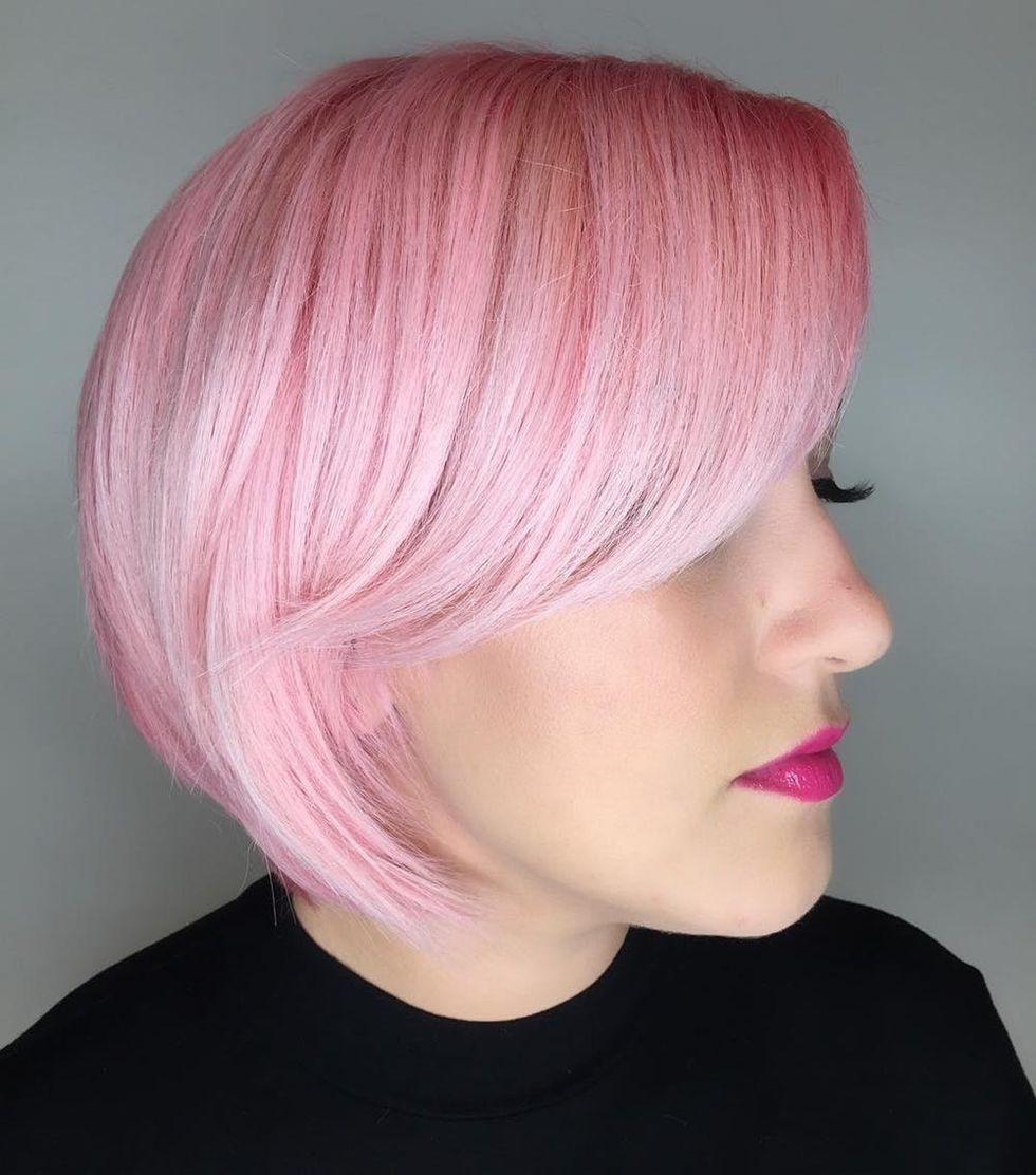 Woman with a vibrant magenta bob haircut
