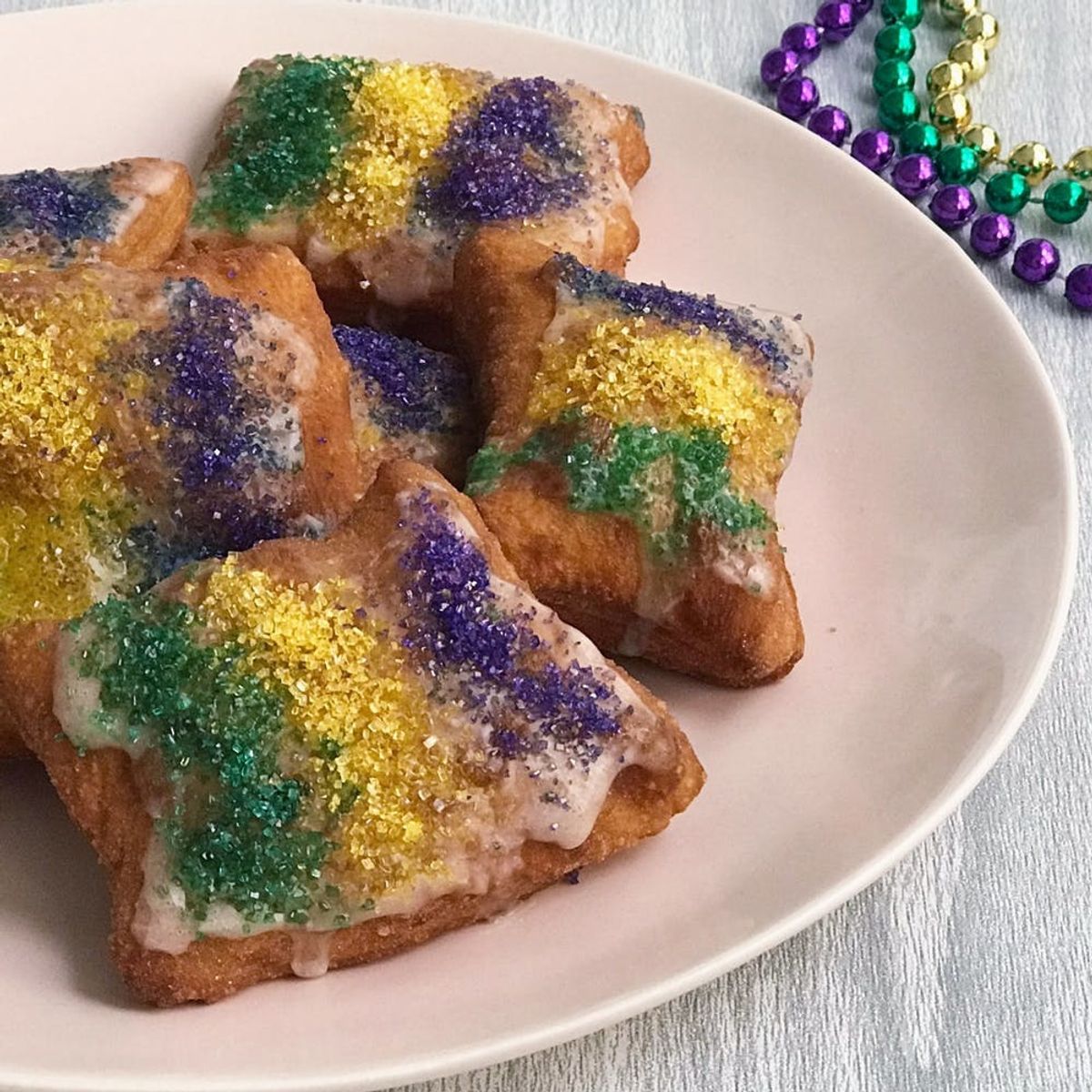 This King Cake Beignets Recipe Is Everything Mardi Gras in One Bite