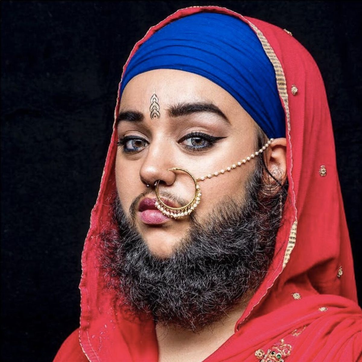 This Female Model With a Full Beard Has Become an Unexpected Beauty Guru