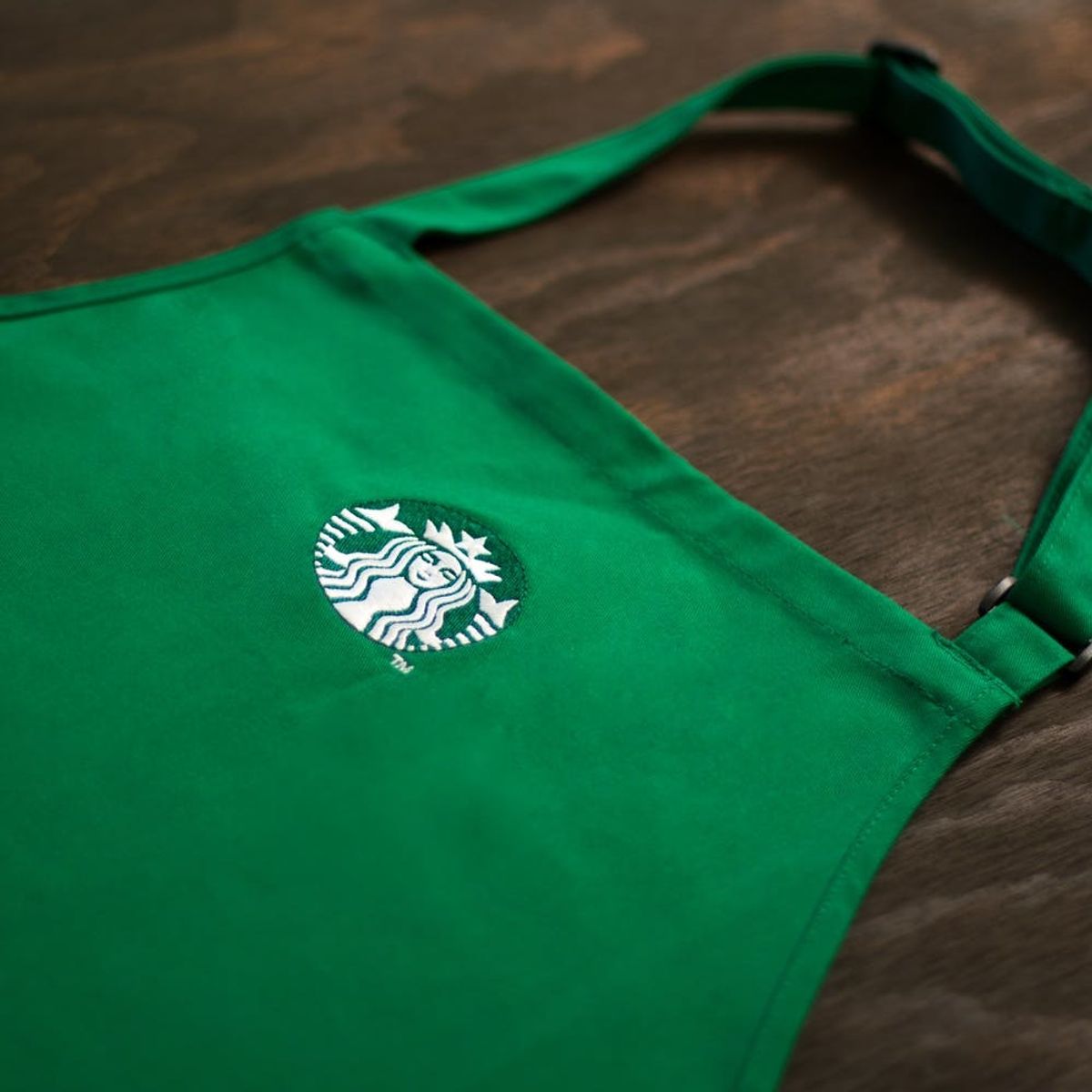 Here’s the *Real* Reason Starbucks Baristas Wear Those Green Aprons