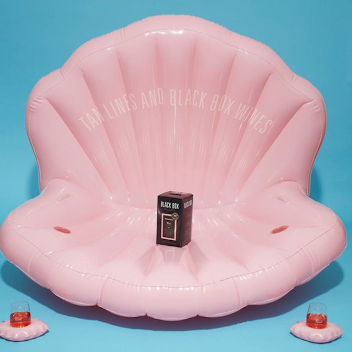 You Absolutely Need This Floating Chaise Lounge SPECIFICALLY Made for Drinking Rosé