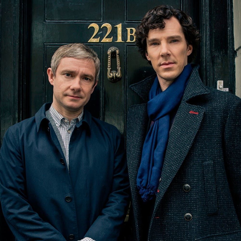 portrait photo of TV characters Holmes (right) and Sherlock (left)