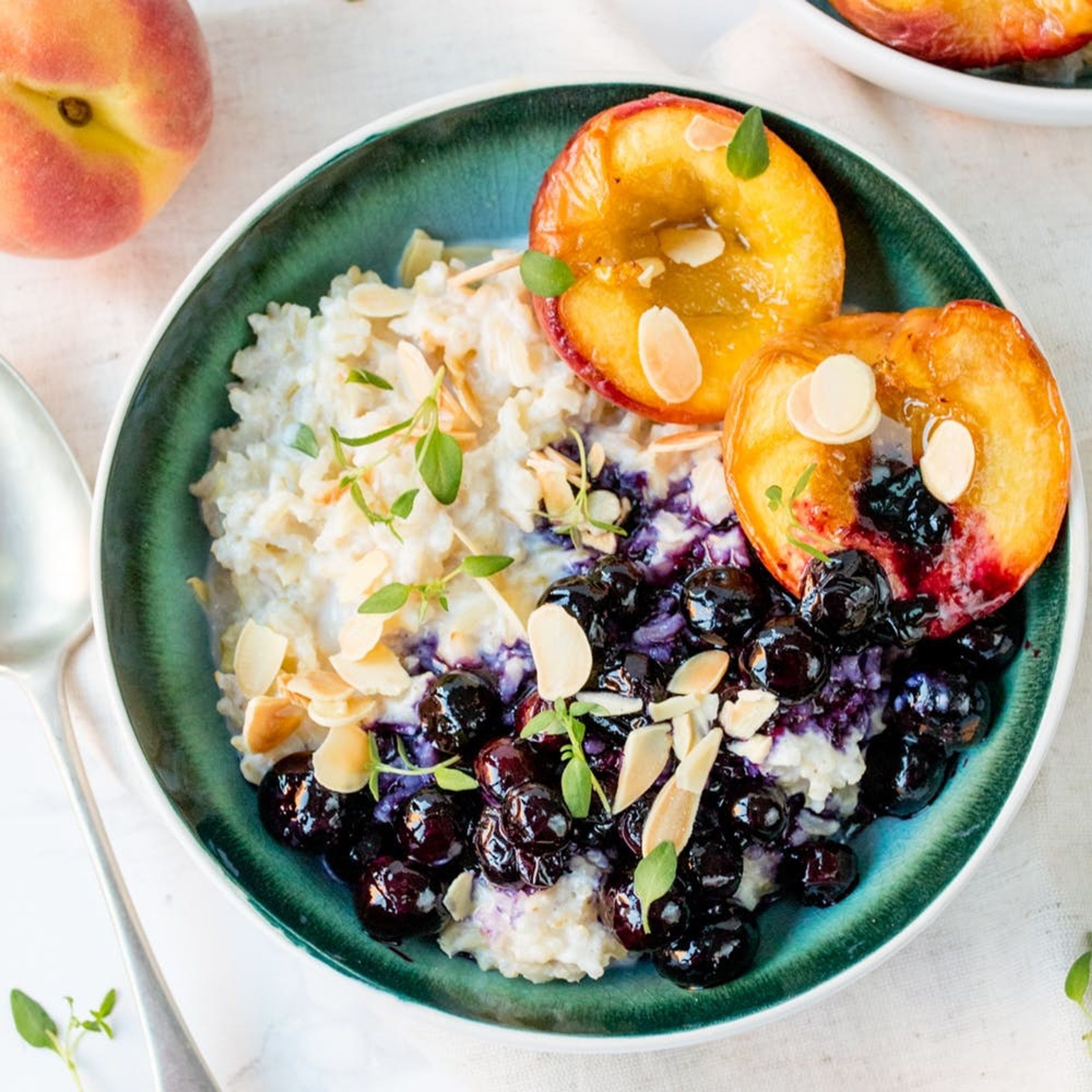 Try Our Gluten-Free Brown Rice Oatmeal With Roast Peaches And Blueberries